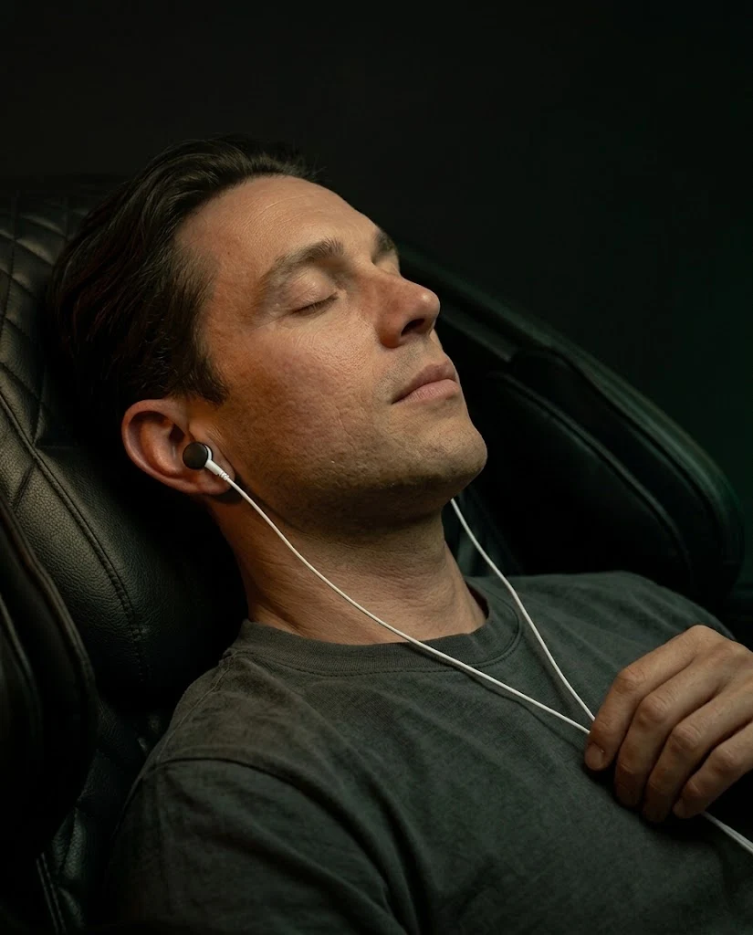 The Nervous System Regulation room at ReviveO2, chair reclined with the lights low.